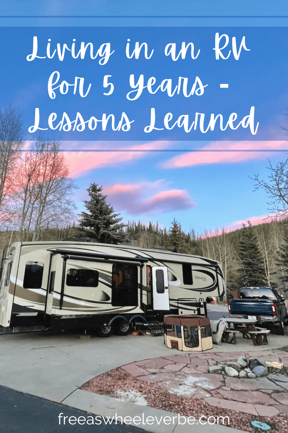 living in an RV pinterest pin showing a fifth-wheel RV surrounded by mountains and pink clouds 